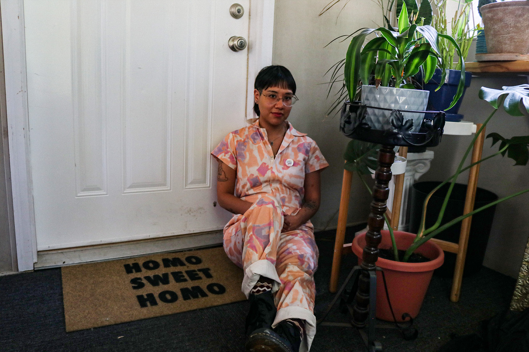 Foote sits near a doormat that reads: “Homo Sweet Homo.”